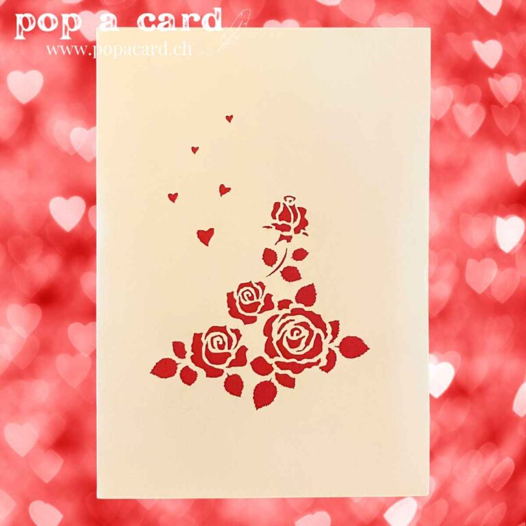 Cream cover with cascading red roses cut‑out on pop‑up wedding greeting card