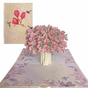 Magnolia bouquet pop‑up card displaying cover art beside lush 3‑D interior scene