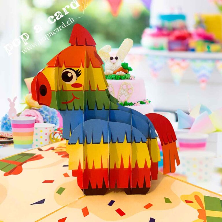 Close‑up of layered rainbow piñata fringe in 3‑D birthday card