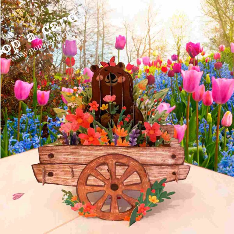 Close‑up of layered flowers and smiling bear in 3‑D spring card