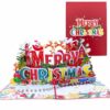 A colorful 3D pop-up card with "Merry Christmas" text and a train, shown open.