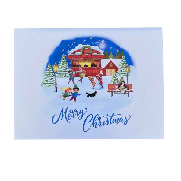 Full view of the open 3D pop-up card showing a Christmas village with characters and a sled.