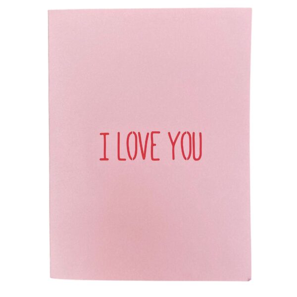 Closed 3D pop-up love card: pink cover with “I LOVE YOU” in red lettering